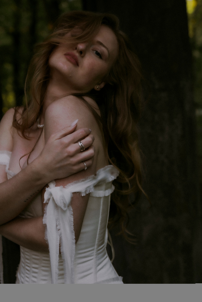 Victoria Bond in a white dress, from her brand photography