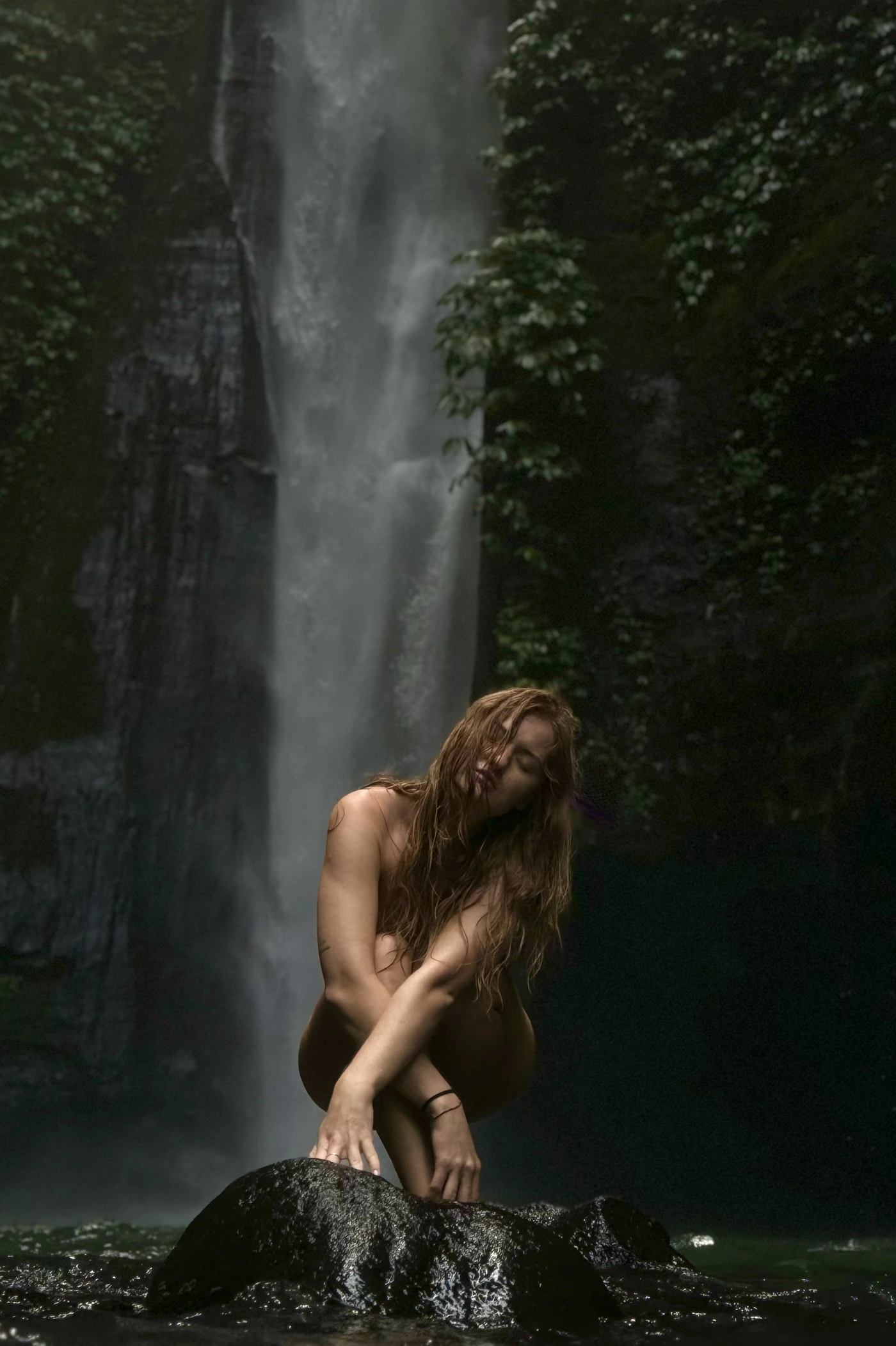 Victoria beside a waterfall